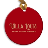 The back of a round holiday ornament. Solid red background with the words Villa Louis across the middle.