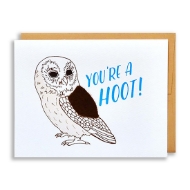 "You're a Hoot" greeting card with line drawing of an owl with a brown felt wing. A brown envelope is behind the white card.