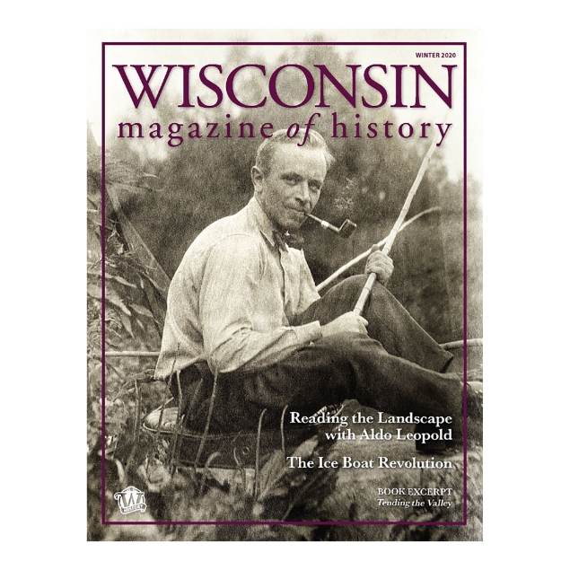 Cover of Wisconsin Magazine of History Winter 2020 edition. Sepia tone image of Aldo Leopold seated in natural setting smoking a pipe, wearing a bow tie.