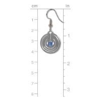 Polished metal dangle earring with perforated round shape and blue glass bead in center. Shown next to ruler showing length of about 1.5 inches.