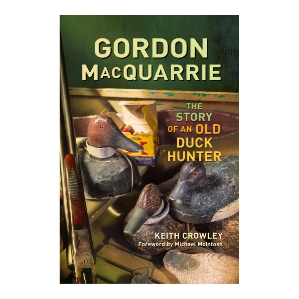 Front cover of the book "Gordon MacQuarrie: The Story of an Old Duck Hunter" by Keith Crowley with a color photo of three duck decoys and a shotgun.