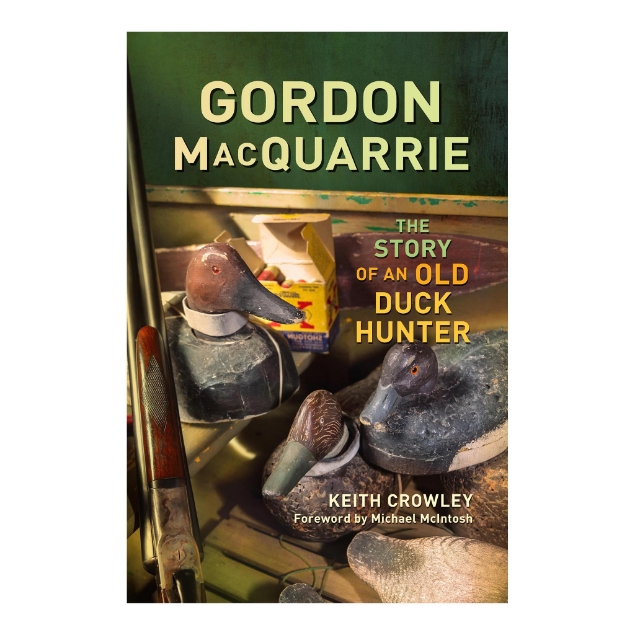 Front cover of the book "Gordon MacQuarrie: The Story of an Old Duck Hunter" by Keith Crowley with a color photo of three duck decoys and a shotgun.
