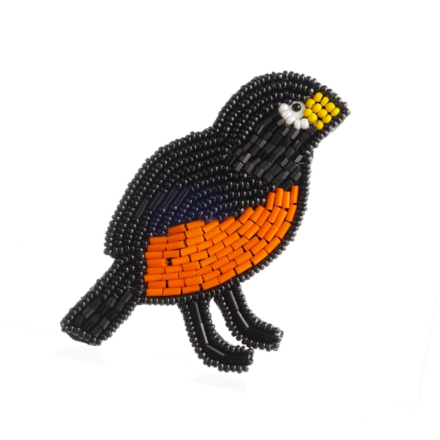 	A lapel pin in the form of an American robin made with colored beads.
